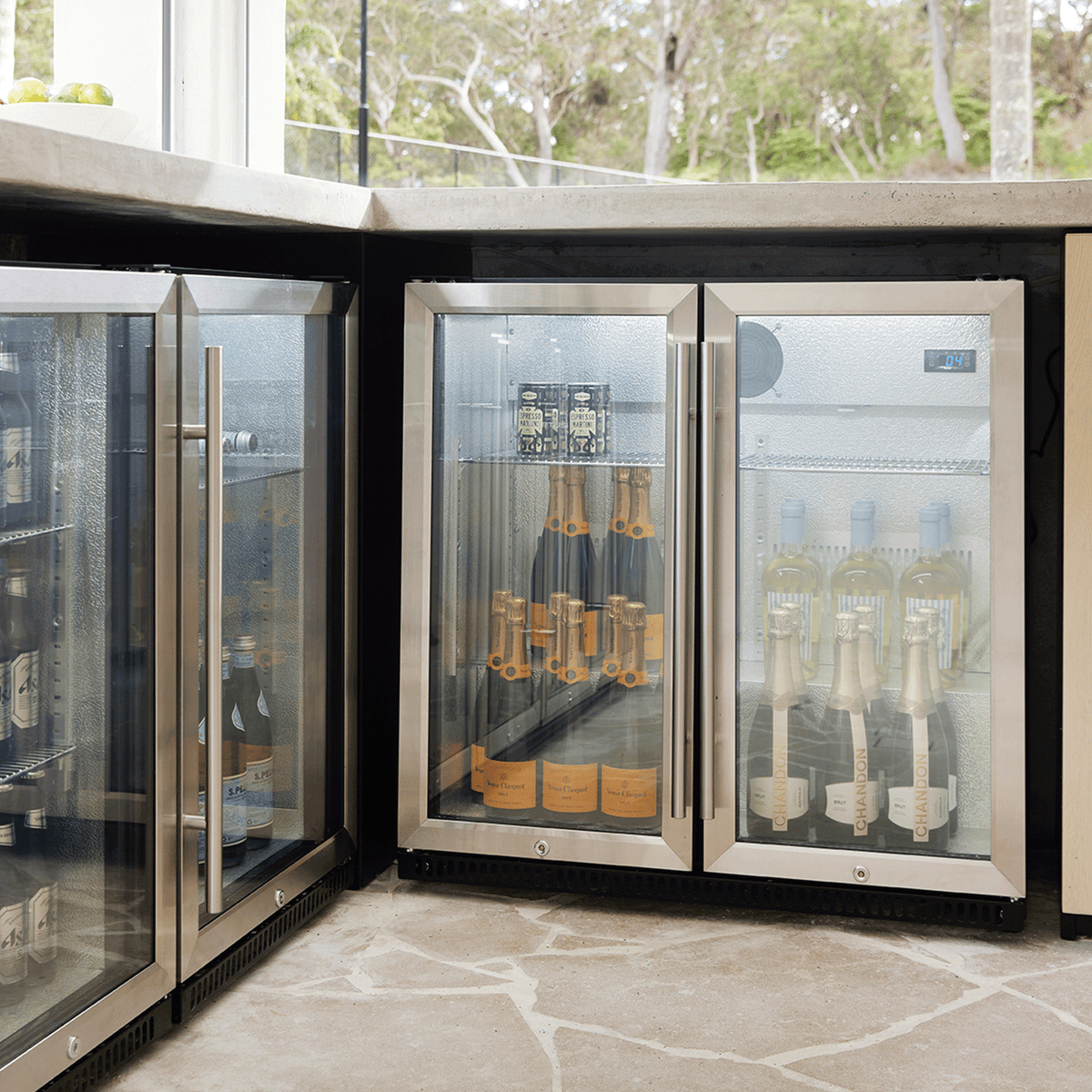 Artusi AOF2S stainless steel double-door outdoor refrigerator installed under an outdoor kitchen benchtop